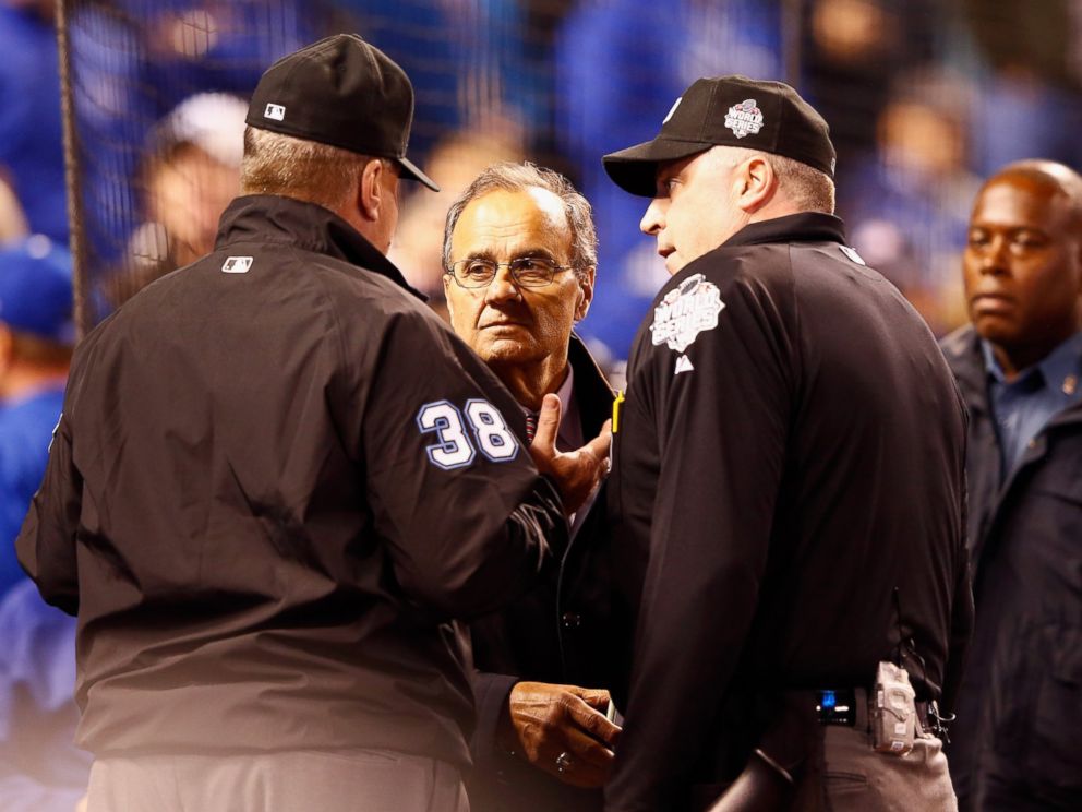 PHOTO:Joe Torre, MLBs Chief Baseball Officer, meets with umpires in the fourth inning to discuss technical difficulties during Game 1 of the 2015 World Series between the Kansas City Royals and the New York Mets, Oct. 27, 2015, in Kansas City, Mo. 