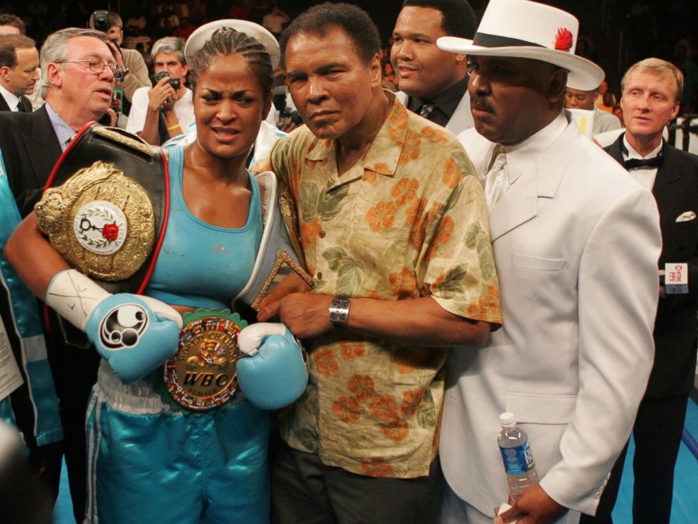 PHOTO:Laila Ali poses with her father, Muhammad Ali, after her 10 round WBC/WIBA Super Middleweight title bout with Erin Toughill, June 11, 2005, in Washington.