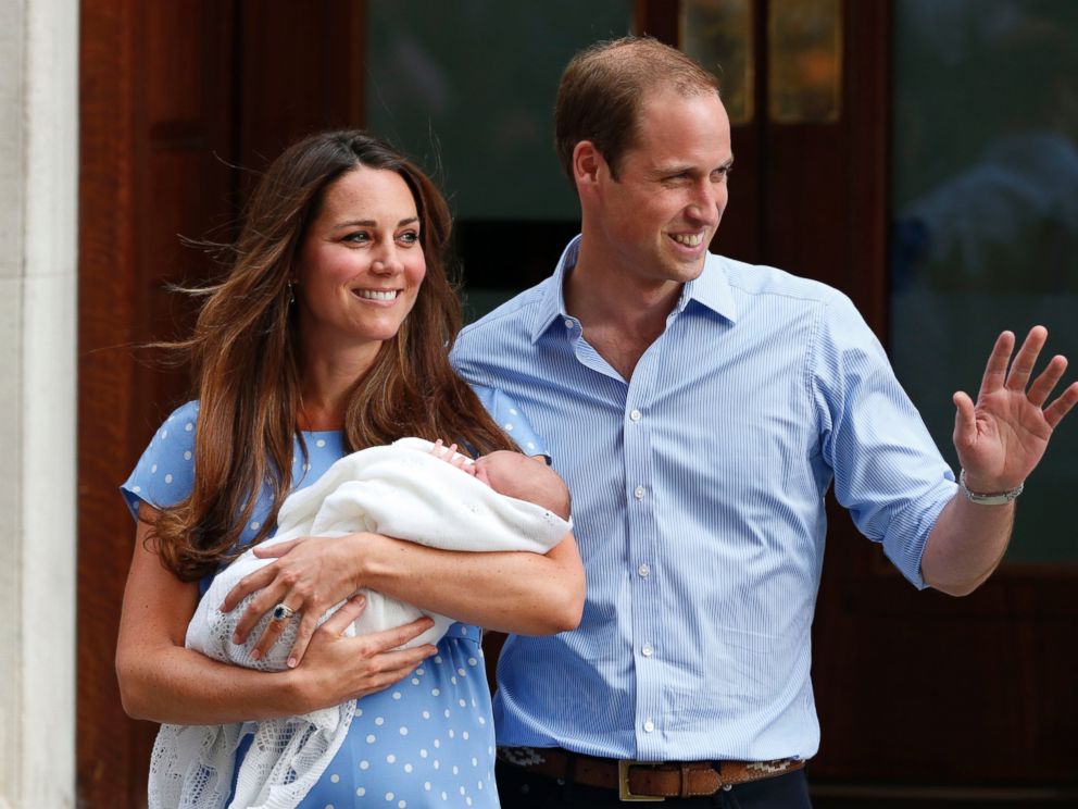 PHOTO: Britains Prince William and Kate, Duchess of Cambridge hold the Prince of Cambridge, July 23, 2013, as they pose for photographers outside St. Marys Hospital exclusive Lindo Wing in London where the Duchess gave birth.