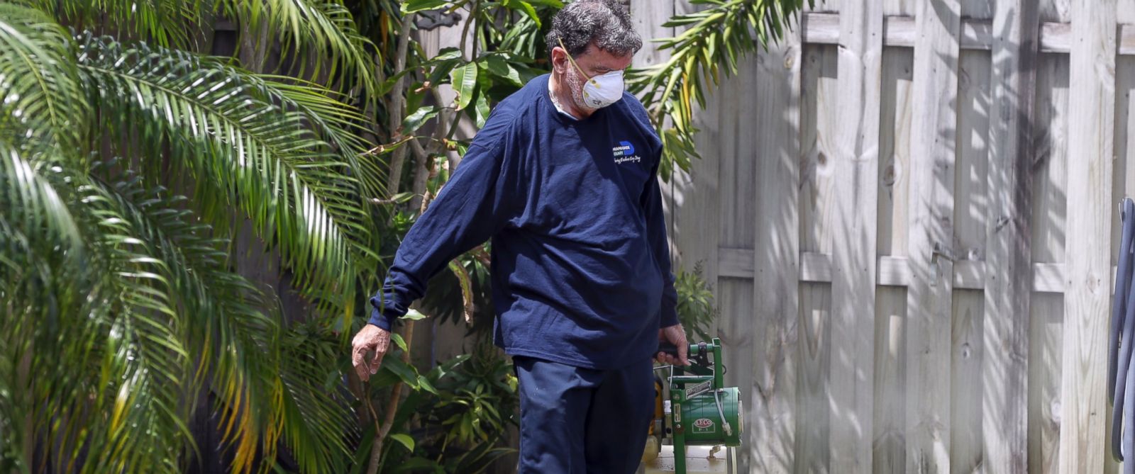PHOTO: An inspector with the Miami- Dade County mosquito control unit, sprays pesticide in the yard of a home, April 12, 2016, in Miami, Florida. The NIH holds a briefing on the Zika Virus, May 3, 2016. 