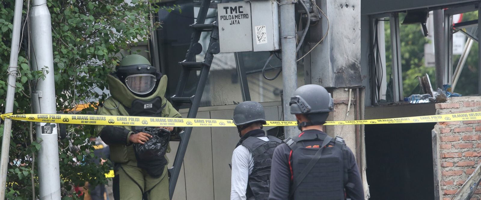 PHOTO: Members of the police bomb squad inspect a police post where an explosion went off in Jakarta, Indonesia, Jan. 14, 2016. 