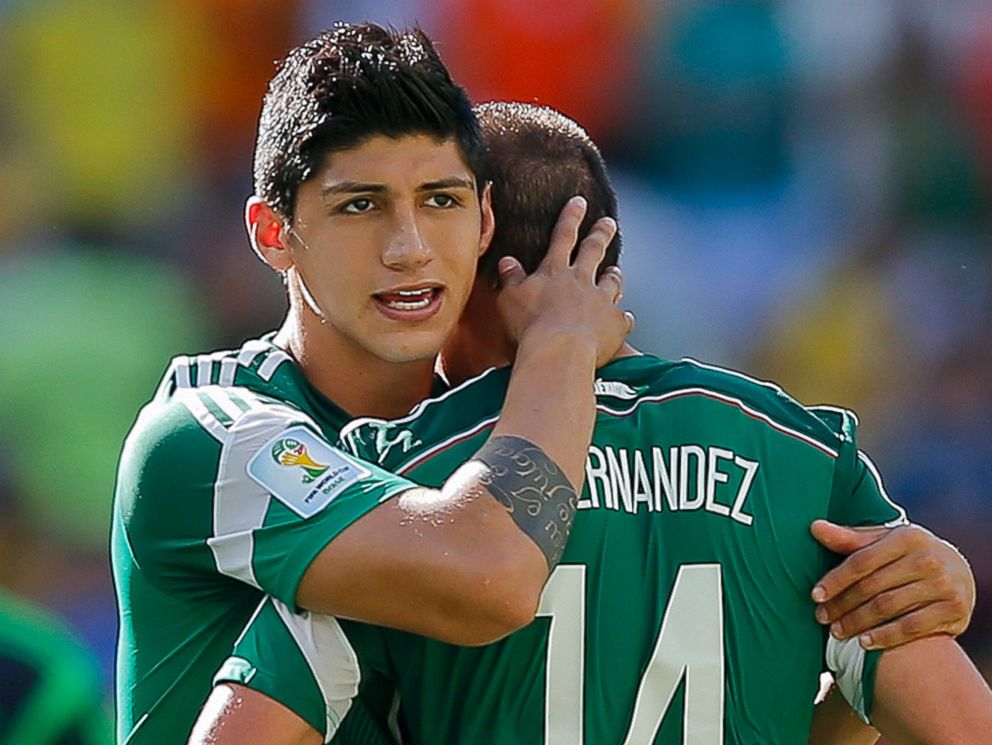 PHOTO: In a June 29, 2014 file photo, Mexicos Alan Pulido seen with Javier Hernandez after the Netherlands defeated Mexico 2-1 during the World Cup round of 16 soccer match between the Netherlands and Mexico at the Arena Castelao in Fortaleza, Brazil.