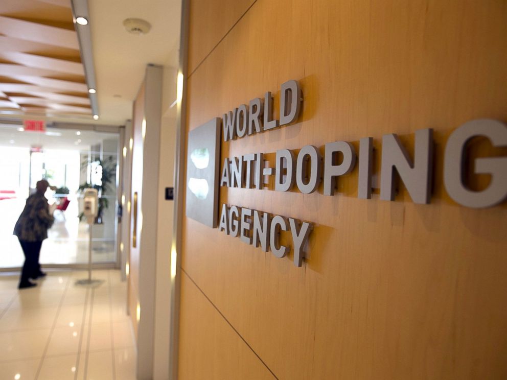 PHOTO: A woman walks into the head office for the World Anti-Doping Agency (WADA) in Montreal, November 9, 2015.