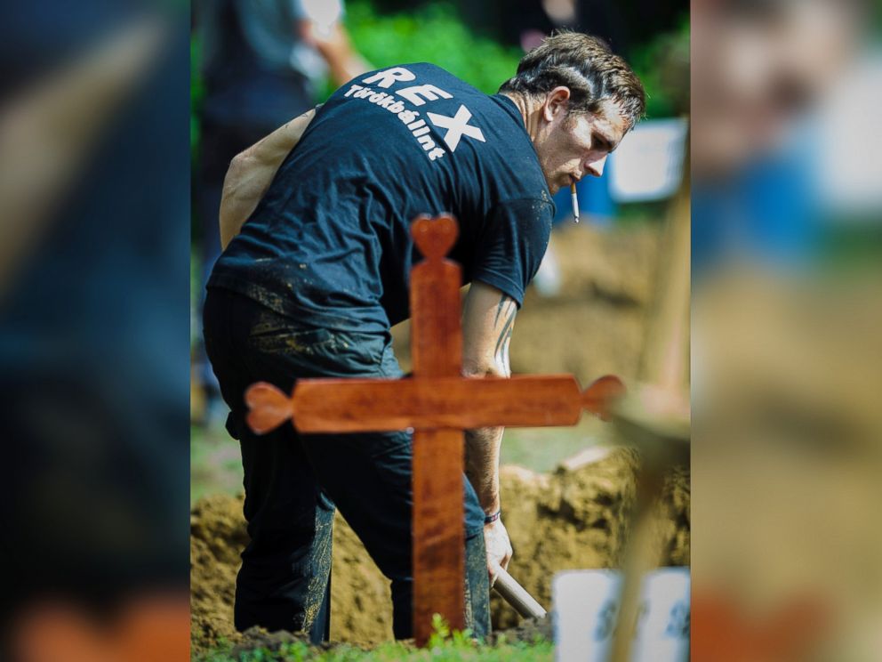 PHOTO: A gravedigger competes during the first National Grave Digging Competition at the public cemetery of Debrecen, Hungary, June 3, 2016.