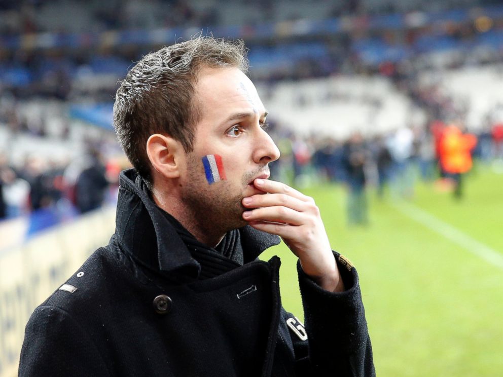 PHOTO: A French supporter reacts after invading the pitch of the Stade de France stadium at the end of a soccer match between France and Germany in Saint Denis, outside Paris, Nov. 13, 2015.
