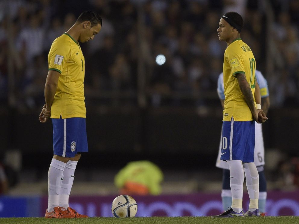 PHOTO: Brazilian football team players Ricardo Oliveira and Neymar Jr. participate in a minute of silence in honor of victims of attacks in France, before their football match against Argentina, in Buenos Aires, on Nov. 13, 2015.