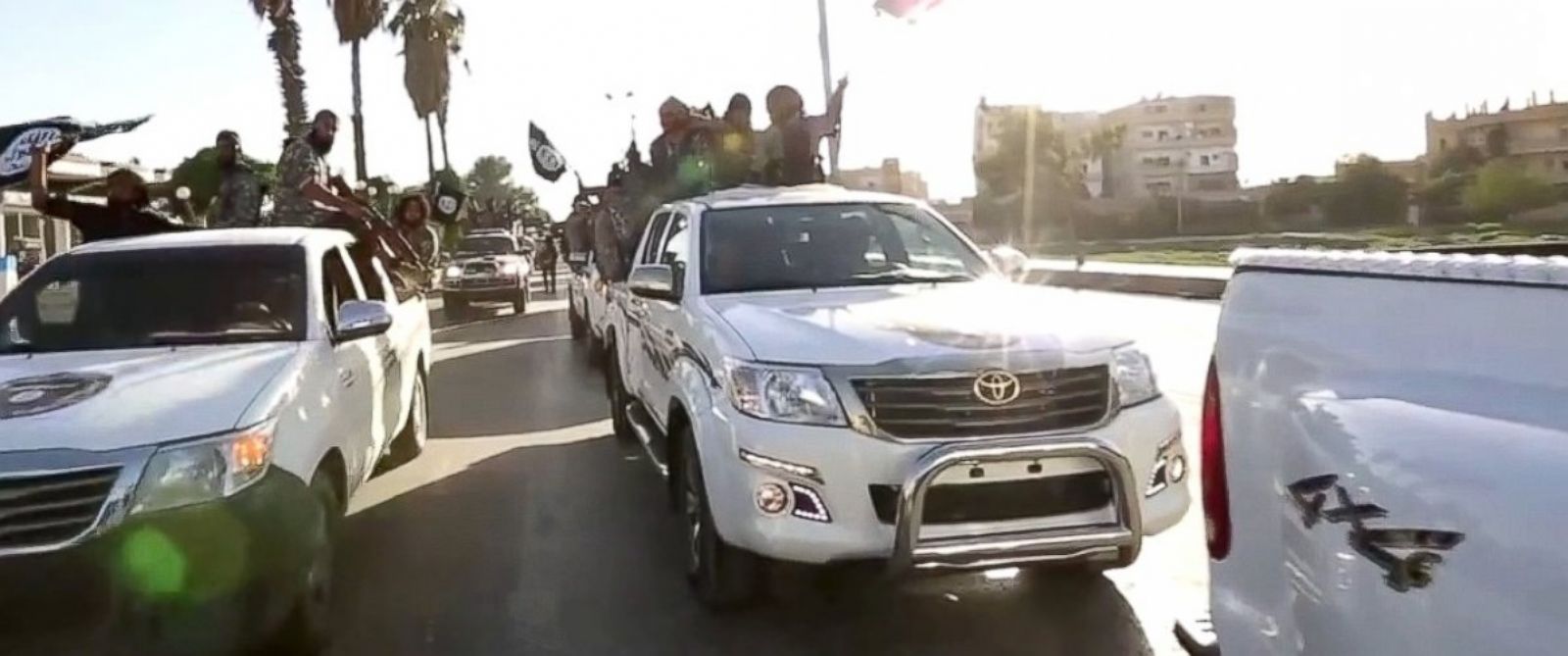 PHOTO: ISIS fighters parade through the streets of Raqqa in a propaganda video released online in July 2014.