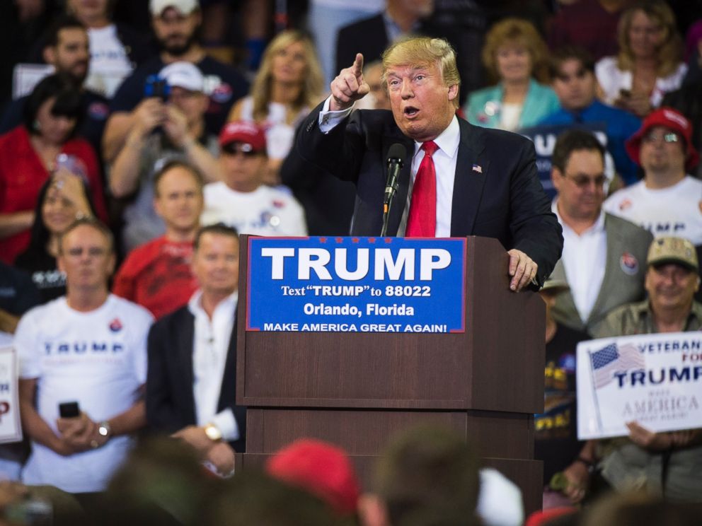 PHOTO: Republican presidential candidate Donald Trump reacts to protestors as he speaks during a campaign event at the CFE Federal Credit Union Arena, March 05, 2016, in Orlando, Fla.