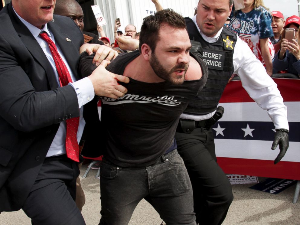 PHOTO: U.S. Secret Service agents detain a man after a disturbance as Republican presidential candidate Donald Trump spoke at Dayton International Airport in Dayton, Ohio, March 12, 2016. 