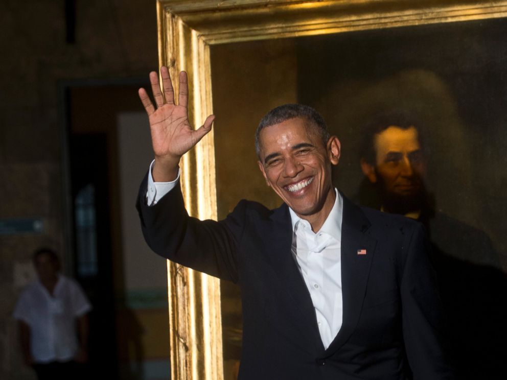 PHOTO: President Barack Obama waves to journalists next to a painting of President Abraham Lincoln at Havanas City Museum during a visit to Old Havana, Cuba, Sunday, March 20, 2016.