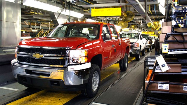 PHOTO A Chevy pickup truck drives off the assembly line of the General 