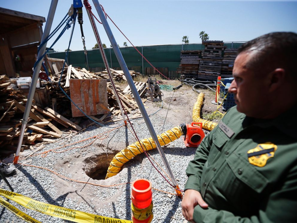 Border Patrol Special Operations Supervisor Cesar Sotelo looks on in front of the entrance to a tunnel leading to Mexico from a lot along the border, Wednesday, April 20, 2016, in San Diego. 