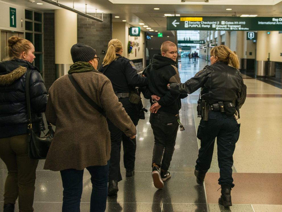 PHOTO: A woman, arrested at a Black Lives Matter protest at the Minneapolis-St. Paul International Airport, is walked by police to a detainment room, Dec. 23, 2015 in Minneapolis.