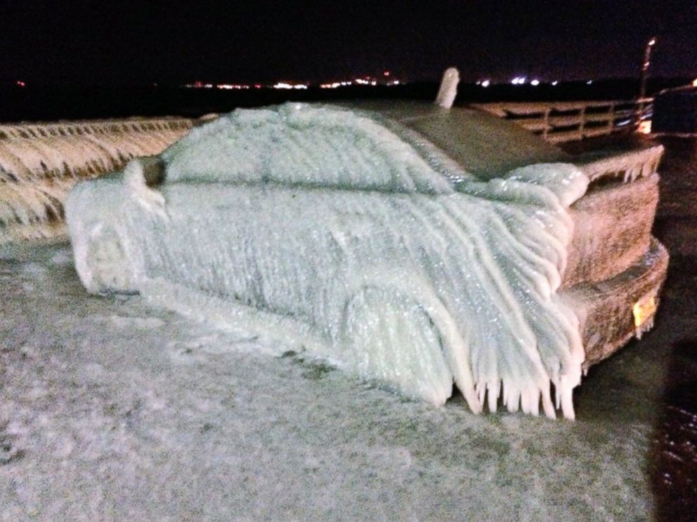 PHOTO: A car off Route 5 in Buffalo froze over from waters from Lake Eerie Sunday night and Monday morning.