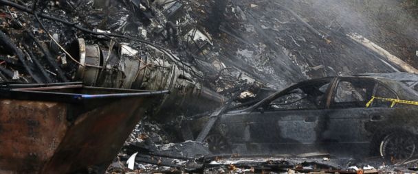 PHOTO:Area police and firefighters work at the scene after a passenger jet crashed into a home on Mogadore Road while on a short approach to Akron-Fulton Airport, Nov. 10, 2015, in Akron, Ohio. 