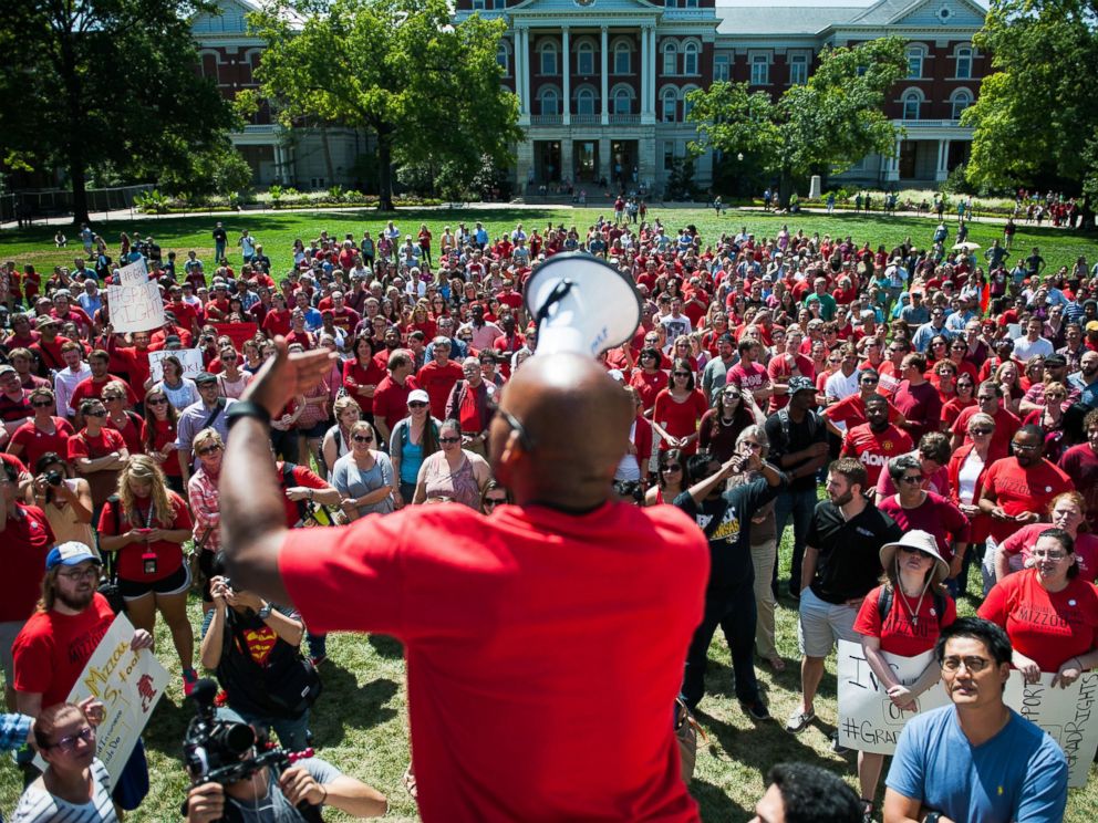 PHOTO: Jonathan Butler encourages a crowd to scream while using a megaphone during a day of action to celebrate graduate students and draw attention to demands on Aug. 26, 2015, near the columns on the University of Missouri campus, in Columbia, Mo.