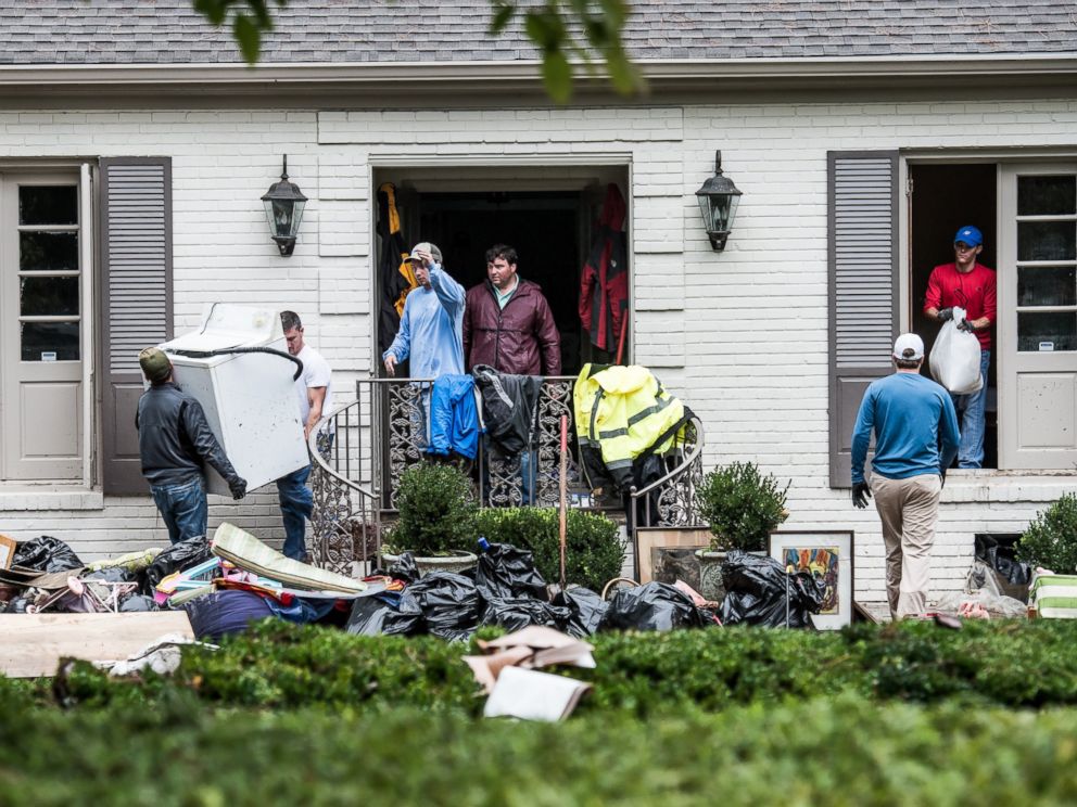 PHOTO: Neighbors and friends help clean up a home affected by flood waters in the Forest Acres neighborhood, Oct. 5, 2015 in Columbia, S.C.