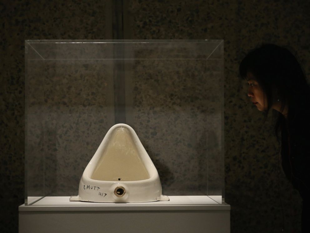 PHOTO: A woman looks at Fountain by Marcel Duchamp during a press preview of an exhibition at the Barbican Art Gallery on Feb. 13, 2013 in London.