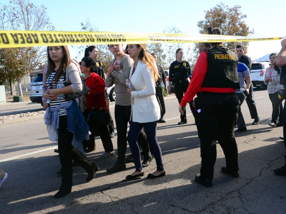 PHOTO: Survivors are evacuated from the scene of a shooting under police and sheriffs escort on Dec. 2, 2015 in San Bernardino, Calif. 