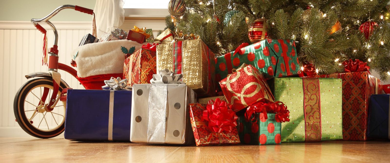 PHOTO: Many presents are seen under a Christmas tree in this stock photo.