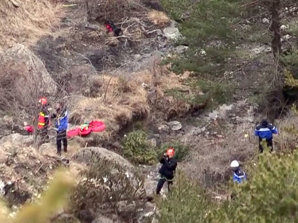 PHOTO:A screengrab taken from an AFP TV video on March 24, 2015 shows search and rescue personnel making their way to the crash site of the Germanwings Airbus A320 that crashed in the French Alps above the southeastern town of Seyne. 