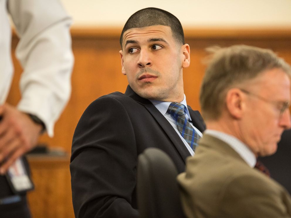 PHOTO:Aaron Hernandez watches as Robert Kraft entered the courtroom during the murder trial of former New England Patriots tight end at Bristol County Superior Court in Fall River, Mass., March 31, 2015. 