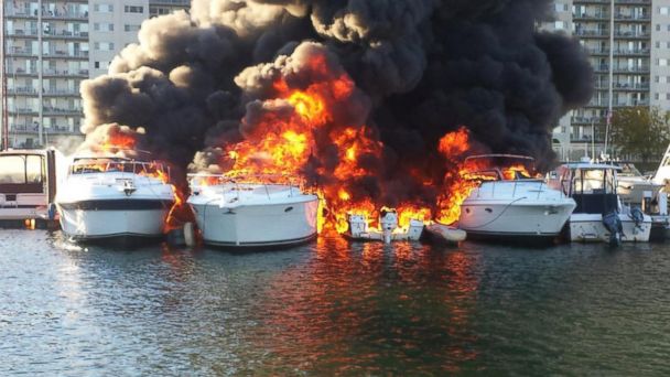 Watch Firefighters Put Out Raging Fire Across Several Boats at Marina 